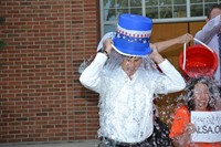 Dr. John Kellogg dumps a bucket of ice water over his head
