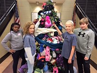Student Council members with the mitten tree