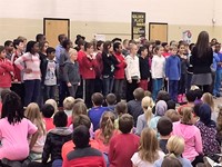Alcott students sing during the Respect Assembly 