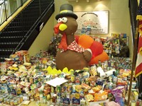 Alcott’s food and product placed in front of a turkey mascot