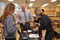 Principal Todd Spinner shares a laugh with students