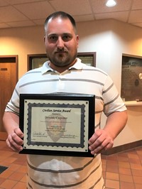 Dominic Carpenter displays his Civilian Service Award from the Westerville Division of Police.
