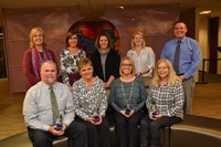 Nine Westerville City Schools employees pose after receiving their A+ Awards