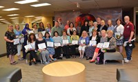 Twenty-nine Retirees posing after the Board of Education reception.