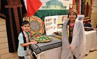 Two students representing their Palestine culture 