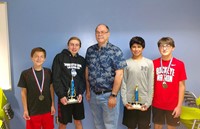 Marv McDaniel, is pictured with chess champions