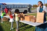 Stephen Gale gratefully accepts food collected and bagged by Robert Frost students