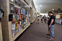 Students looking at artwork