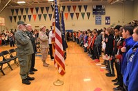 pupils stand and recite the Pledge of Allegiance