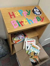 Birthday book shelf at Alcott Elementary