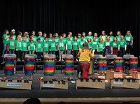 Emerson first and second graders perform on stage together.