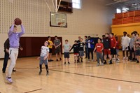 Students to shooting hoops