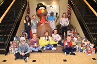 Student Council members with Alcott food drive items