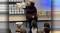 Author Christine Azeez reads to students