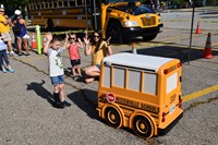 Children and parents with Buster the Bus.