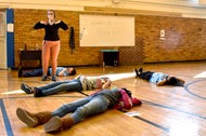 Hanby physical education teacher Sarah Speck leads students through a yoga practice.