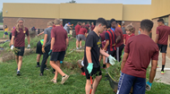 Westerville North High School Boys Soccer team volunteers at Robert Frost