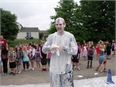 Alcott Physical Education Teacher Paul McNeal gets Pied for a Good Cause