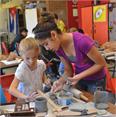 Two students working with clay during Summer Camp