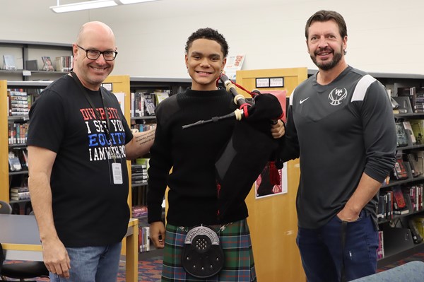 Westerville Central sophomore greets veterans with a bagpipe performance.
